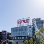 Streaming Wars Are Quietly Bankrupting Giants — Exterior view of Netflix headquarters in Los Angeles under a clear sky.